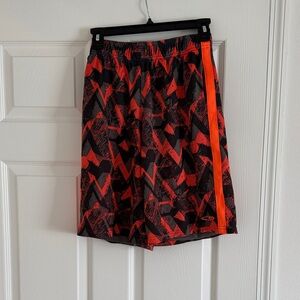 Youth Athletic Shorts with Black, Red, and Orange Abstract Print